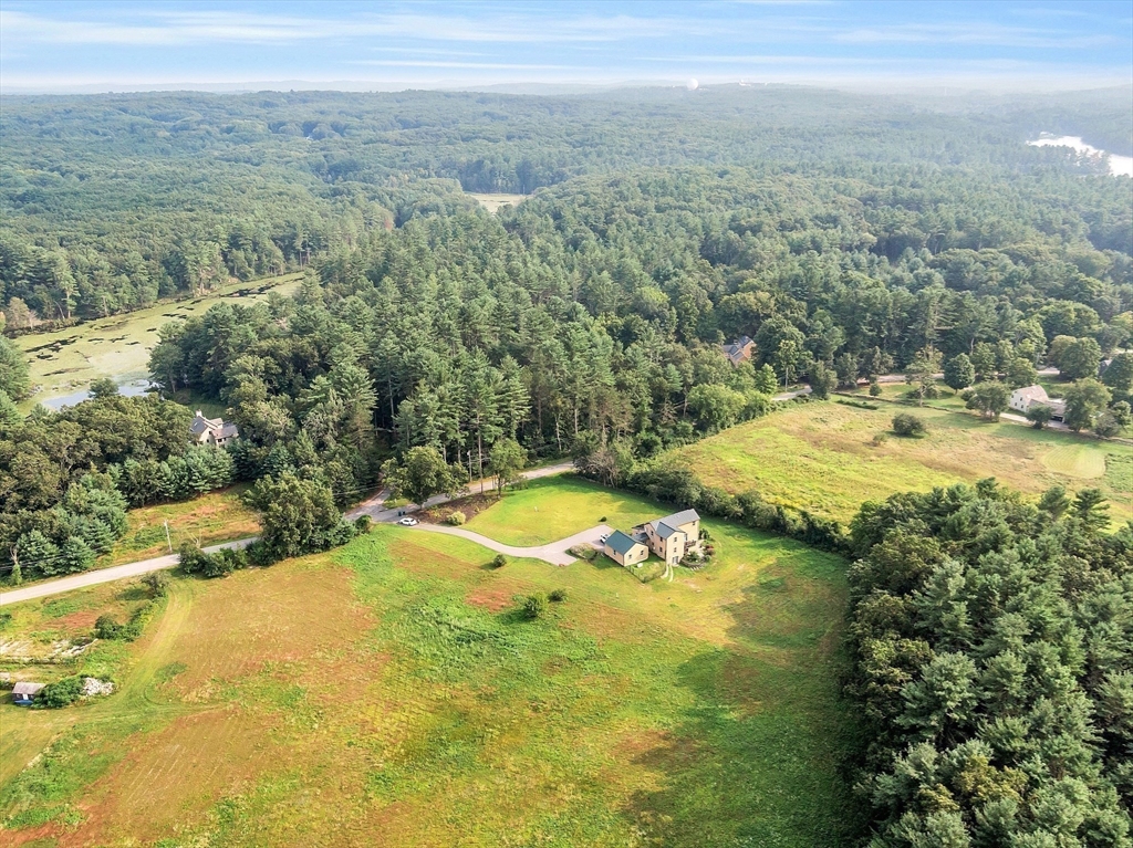 295 Pond Street Dunstable, MA 01827 - Photo 14 of 14 a view of a pool with a yard