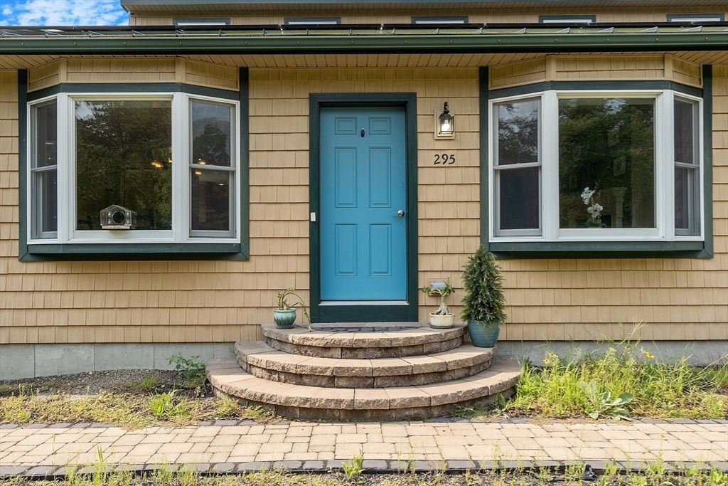 295 Pond Street Dunstable, MA 01827 - Photo 3 of 14 a front view of a house with a yard