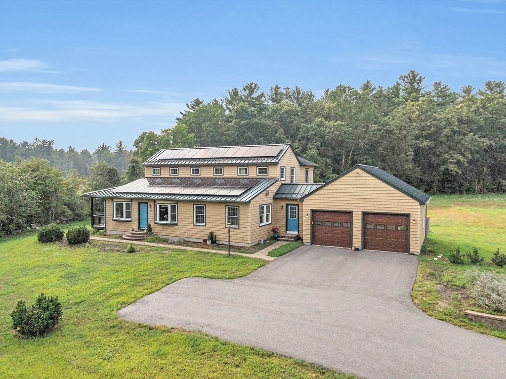 295 Pond Street Dunstable, MA 01827 - Photo 5 of 14 front view of a house with a yard