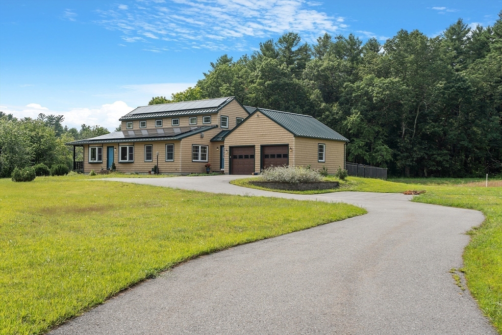 295 Pond Street Dunstable, MA 01827 - Photo 6 of 14 a view of house with a swimming pool