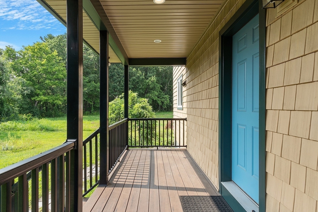 295 Pond Street Dunstable, MA 01827 - Photo 8 of 14 a view of a balcony with wooden floor