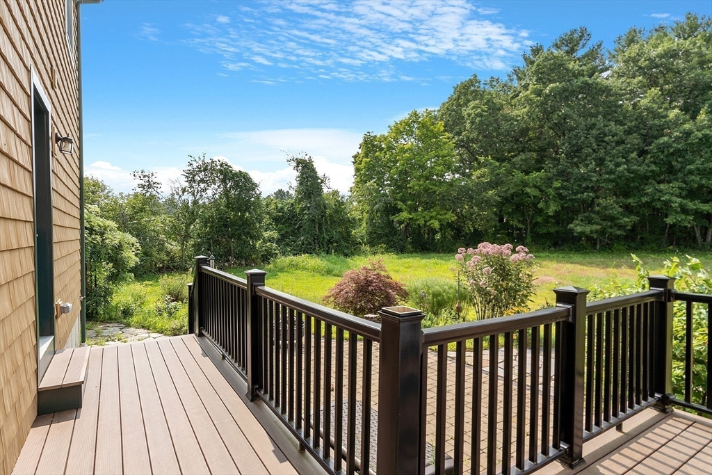 295 Pond Street Dunstable, MA 01827 - Photo 9 of 14 a view of balcony with wooden floor and fence