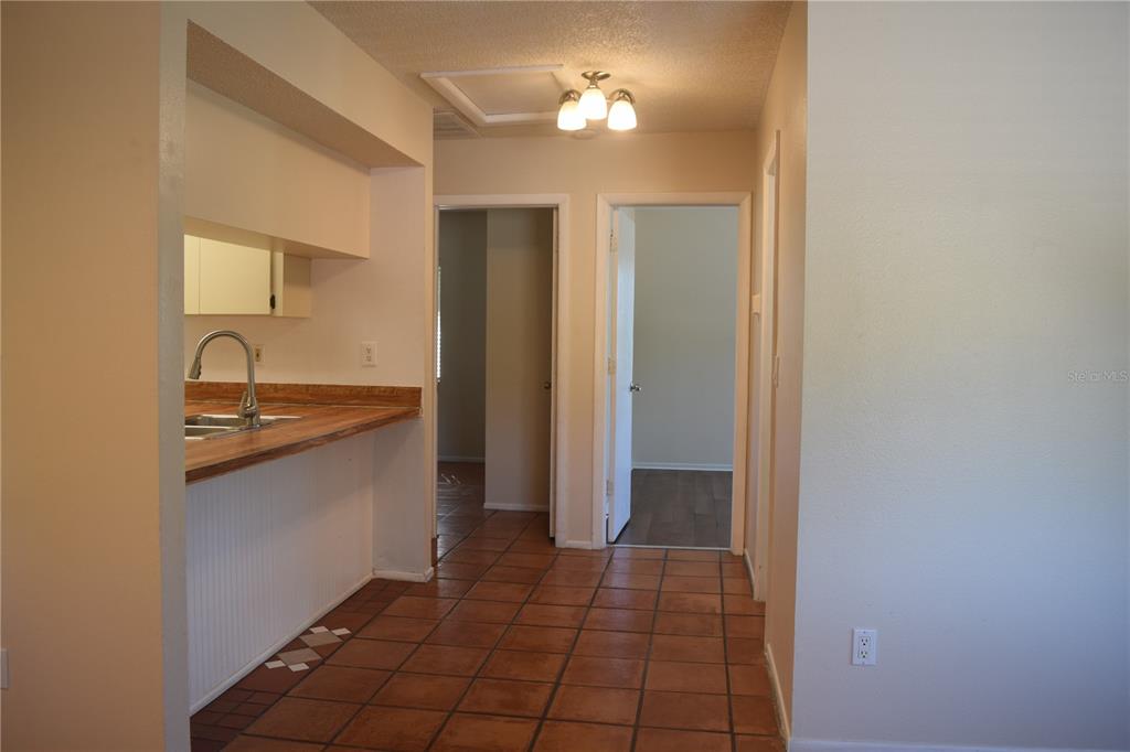 9000 Griggs Road, Unit G Englewood, FL 34224 - Photo 8 of 24 a bathroom with a sink and a mirror