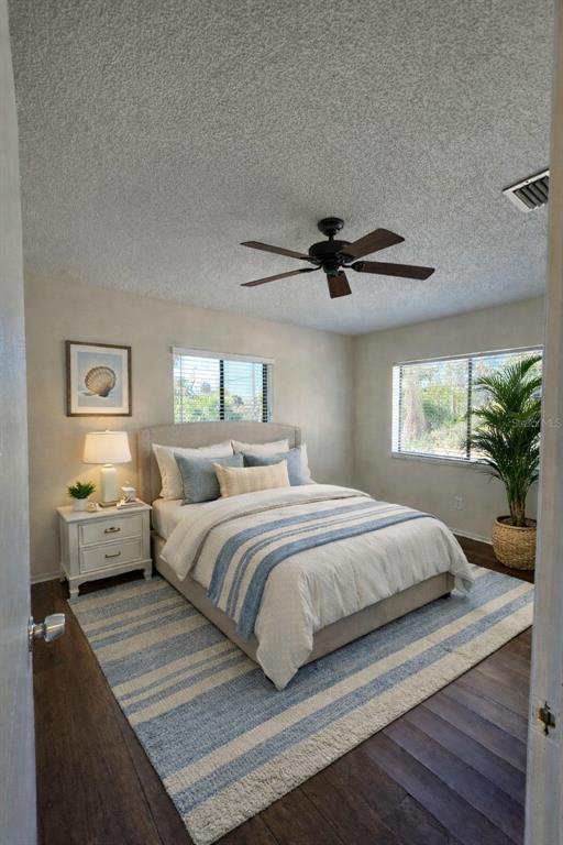 9000 Griggs Road, Unit G Englewood, FL 34224 - Photo 9 of 24 a bedroom with a bed couch and window