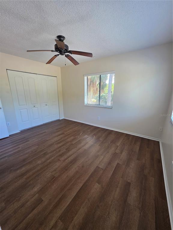 9000 Griggs Road, Unit G Englewood, FL 34224 - Photo 10 of 24 wooden floor in an empty room