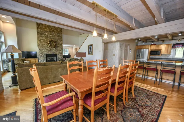 a view of balcony with wooden floor and outdoor seating