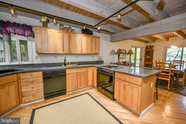 a view of balcony with furniture and wooden floor