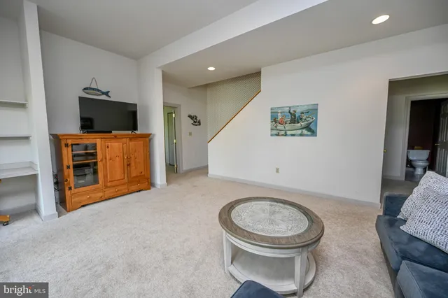 a view of a chair and table in the backyard