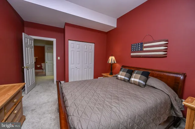 a view of a pathway both side of grassy field with shrub