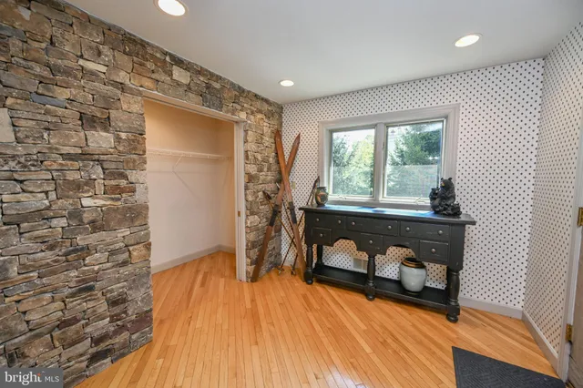 a kitchen with stainless steel appliances granite countertop a refrigerator a sink dishwasher a stove and a microwave oven on granite countertops