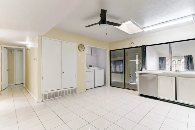 a view of a kitchen with cabinet and entryway