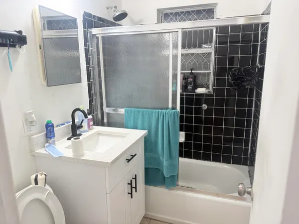 a bathroom with a shower and a toilet