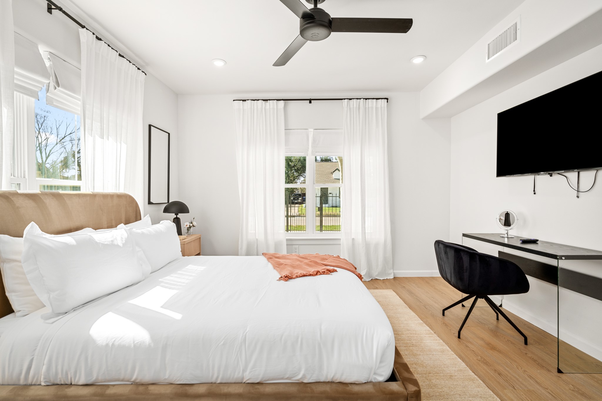 2413 Isabella Street Houston, TX 77004 - Photo 15 of 50 a bedroom with a bed and a flat screen tv