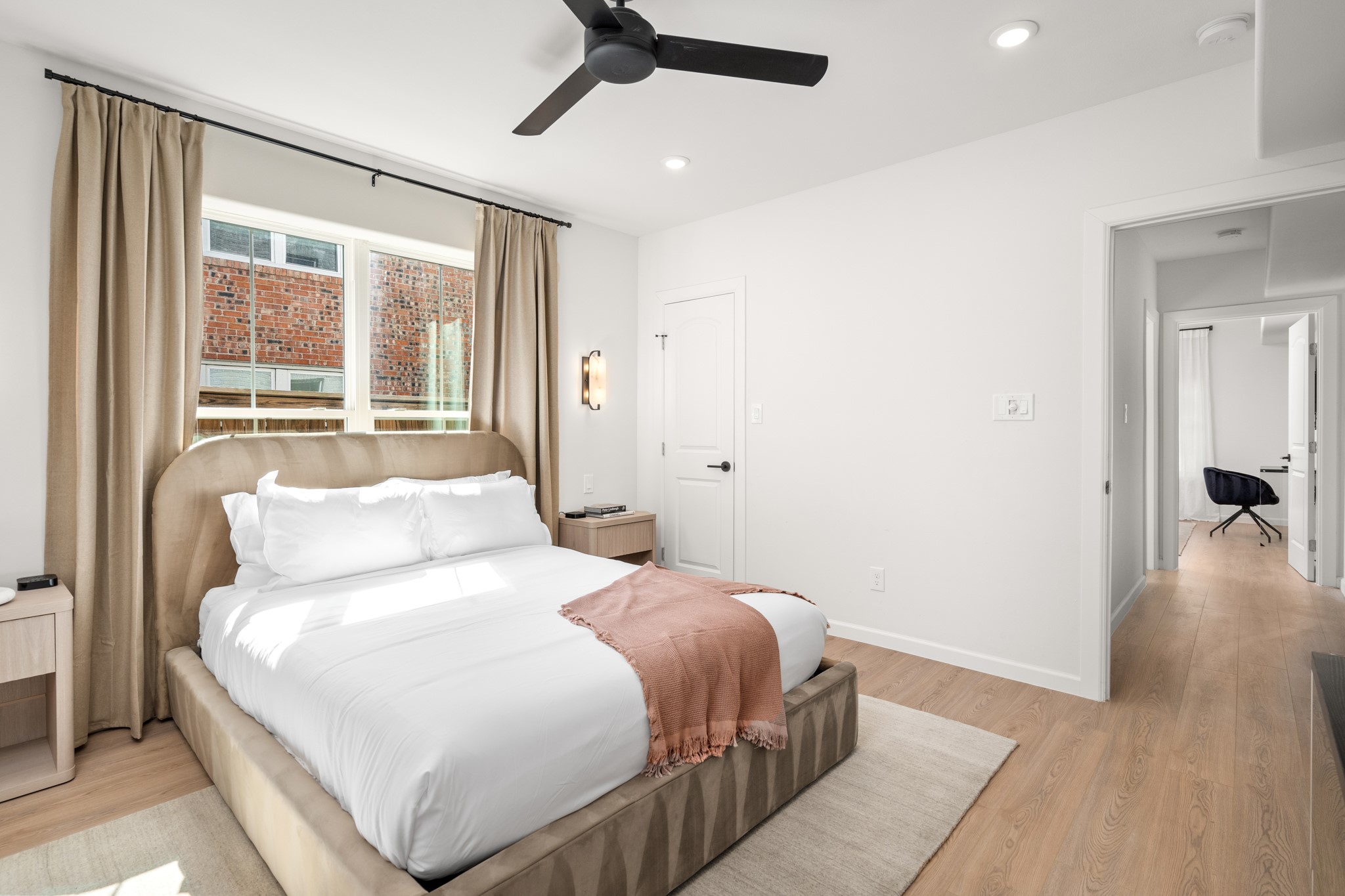 2413 Isabella Street Houston, TX 77004 - Photo 16 of 50 a bedroom with a large bed and a large window