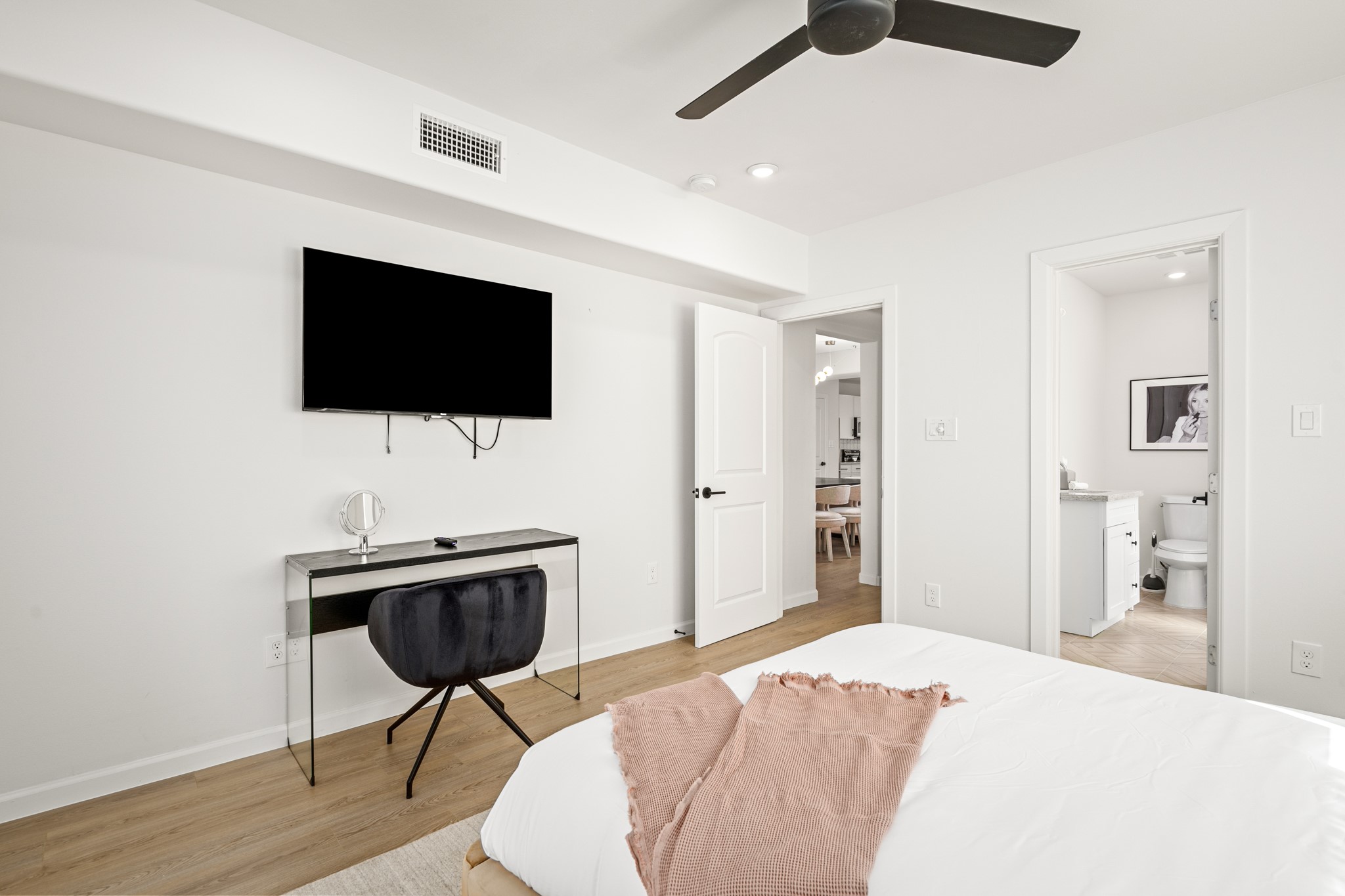 2413 Isabella Street Houston, TX 77004 - Photo 17 of 50 a bedroom with a bed and a flat screen tv