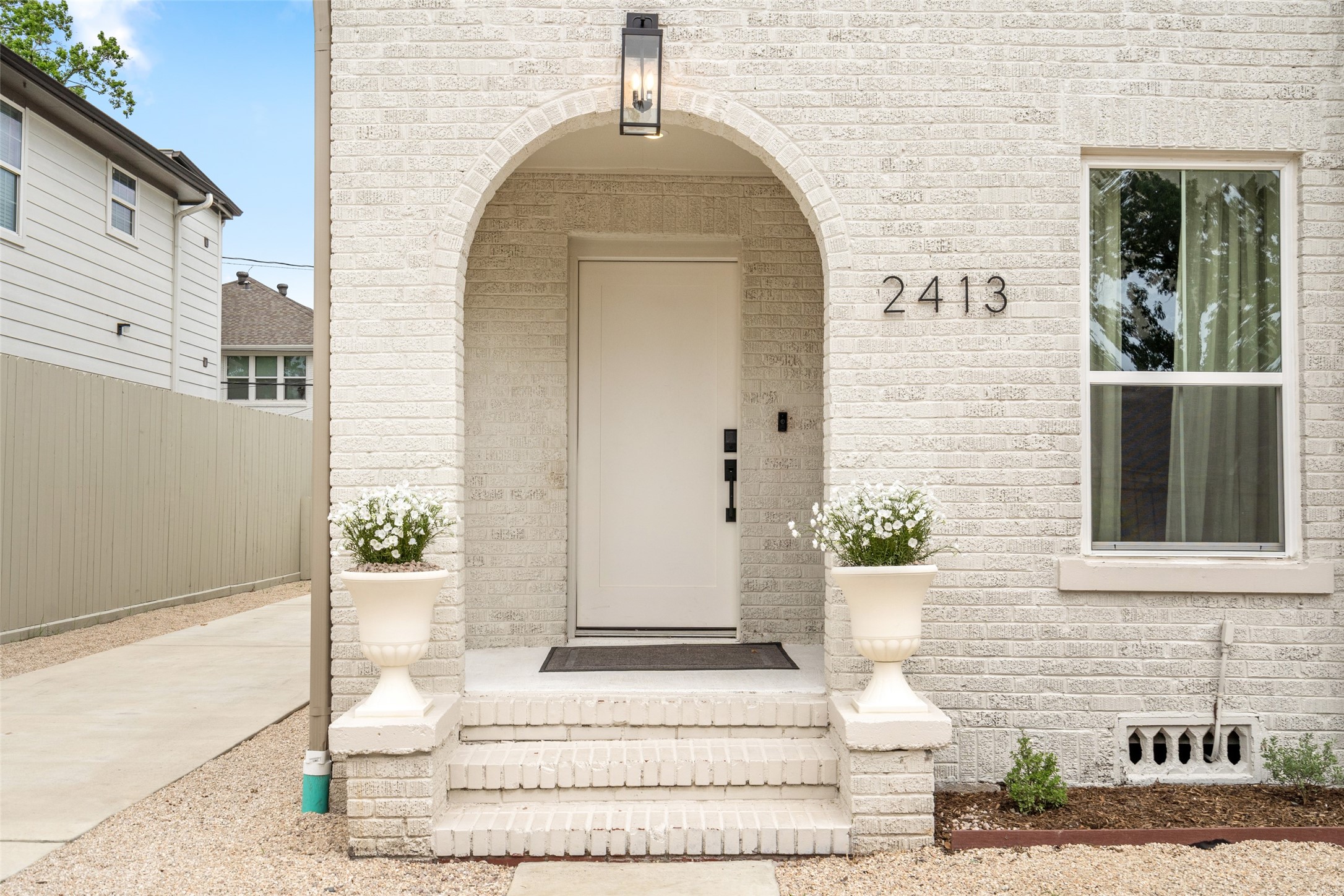 2413 Isabella Street Houston, TX 77004 - Photo 2 of 50 a front view of a house with a garden