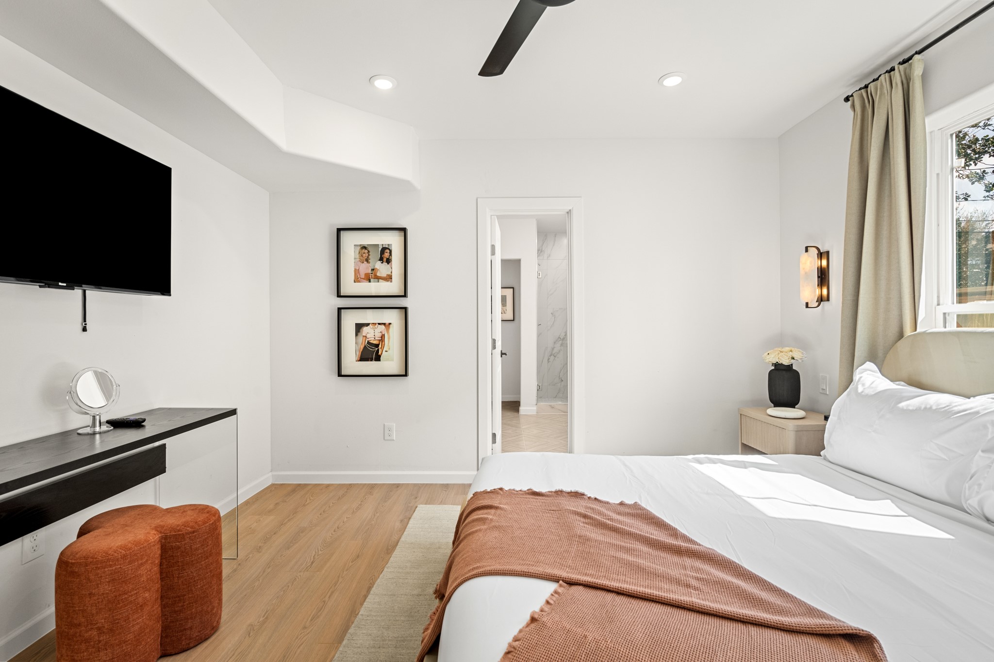 2413 Isabella Street Houston, TX 77004 - Photo 33 of 50 a bedroom with a bed and a flat screen tv