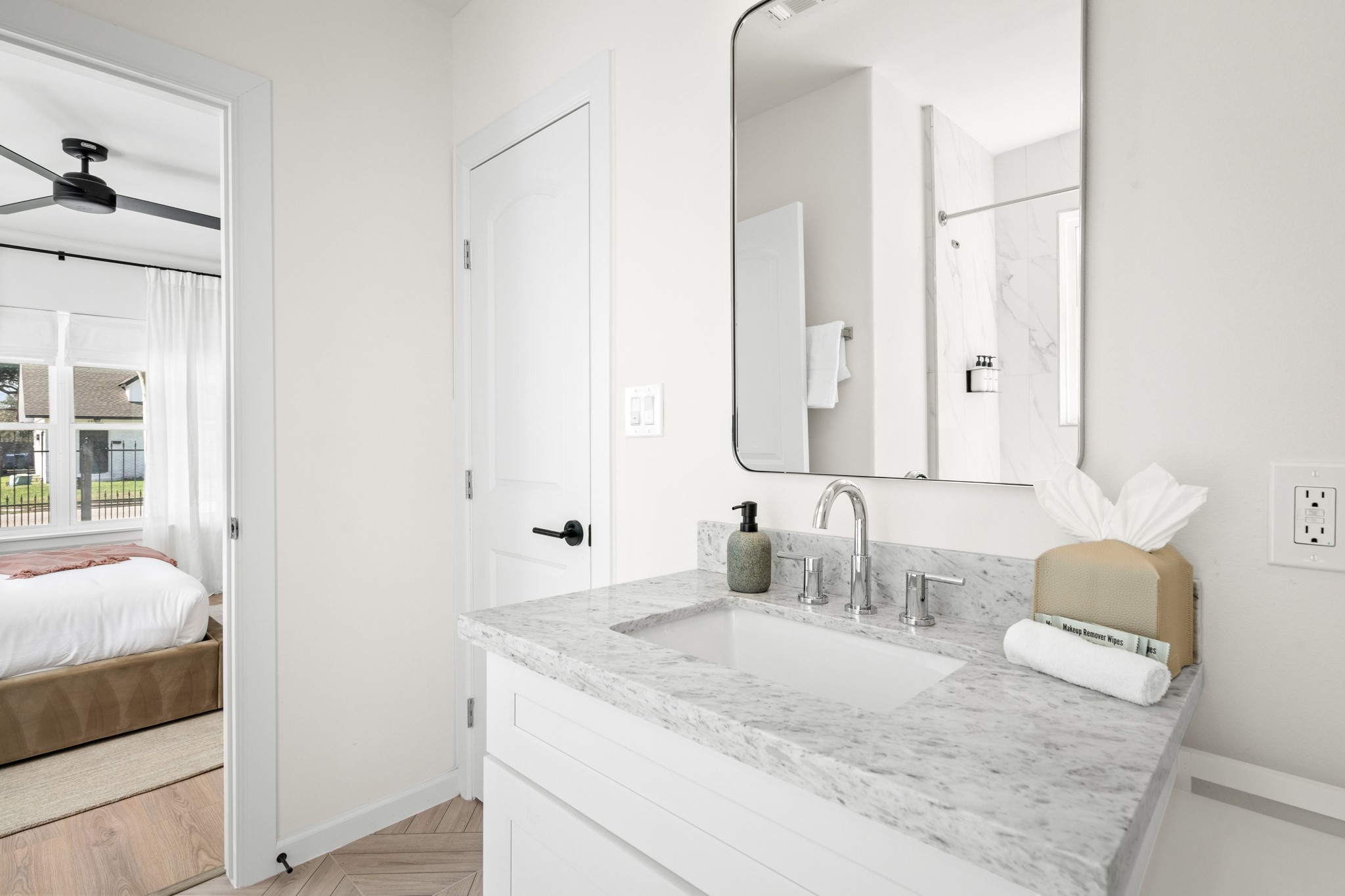 2413 Isabella Street Houston, TX 77004 - Photo 34 of 50 a bathroom with a granite countertop sink and a mirror