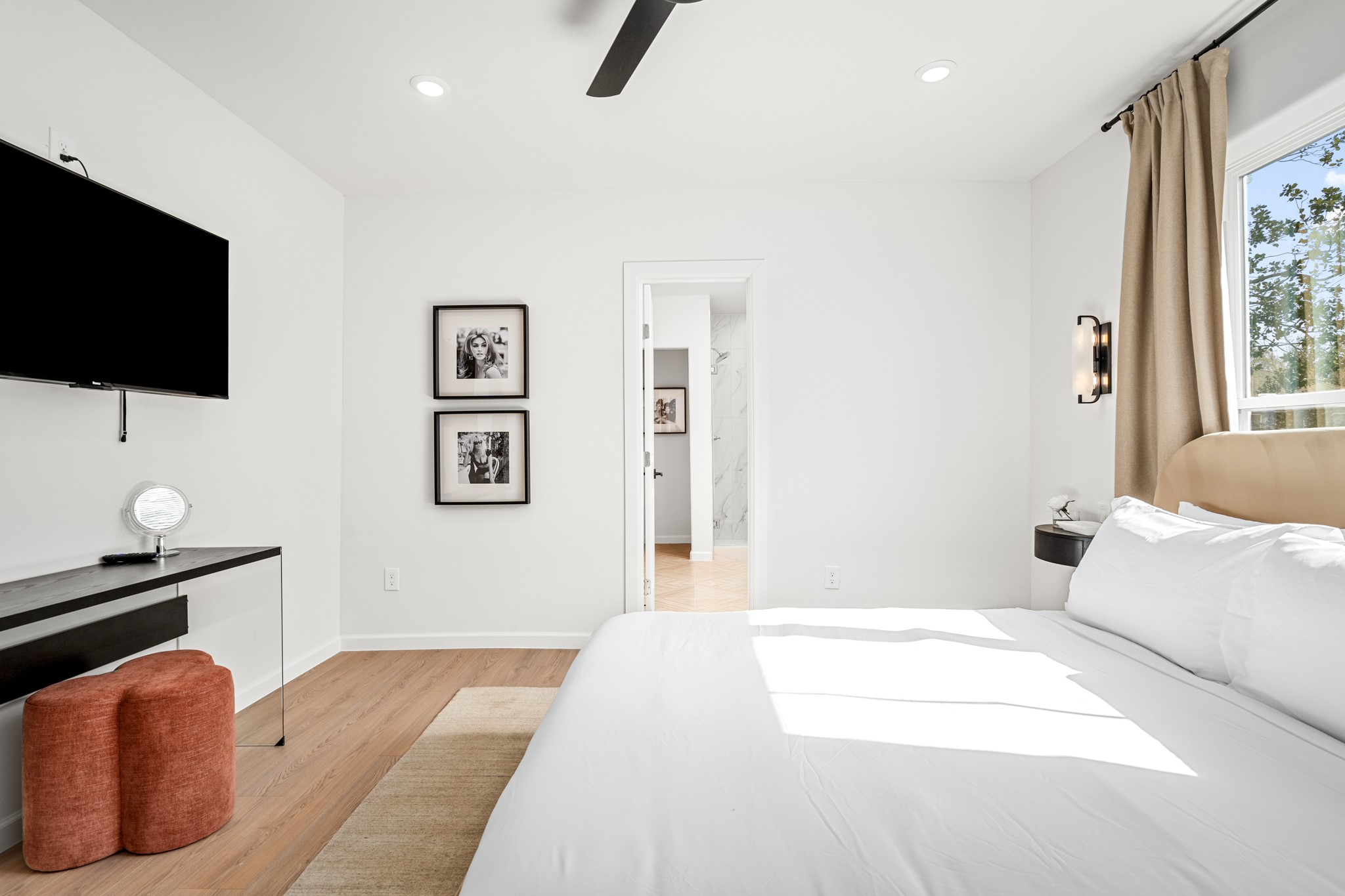 2413 Isabella Street Houston, TX 77004 - Photo 35 of 50 a bedroom with a bed and a flat screen tv