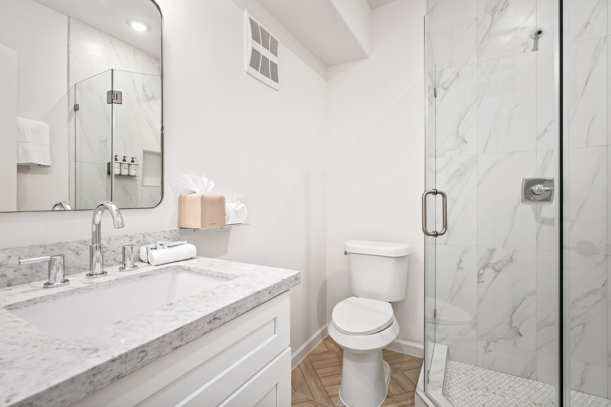 2413 Isabella Street Houston, TX 77004 - Photo 36 of 50 a bathroom with a granite countertop sink a toilet and a shower