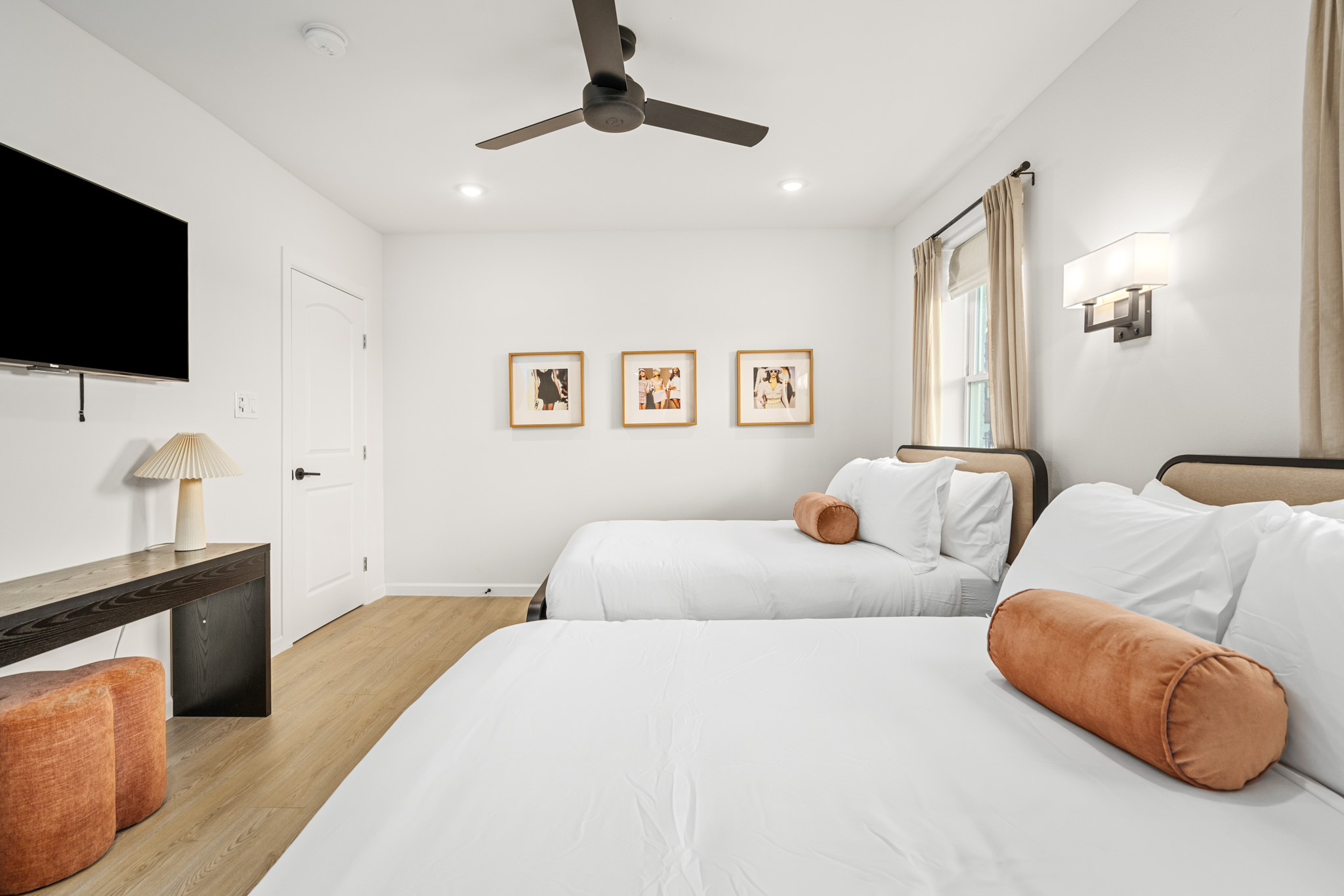 2413 Isabella Street Houston, TX 77004 - Photo 37 of 50 a bedroom with a bed window and flat screen tv