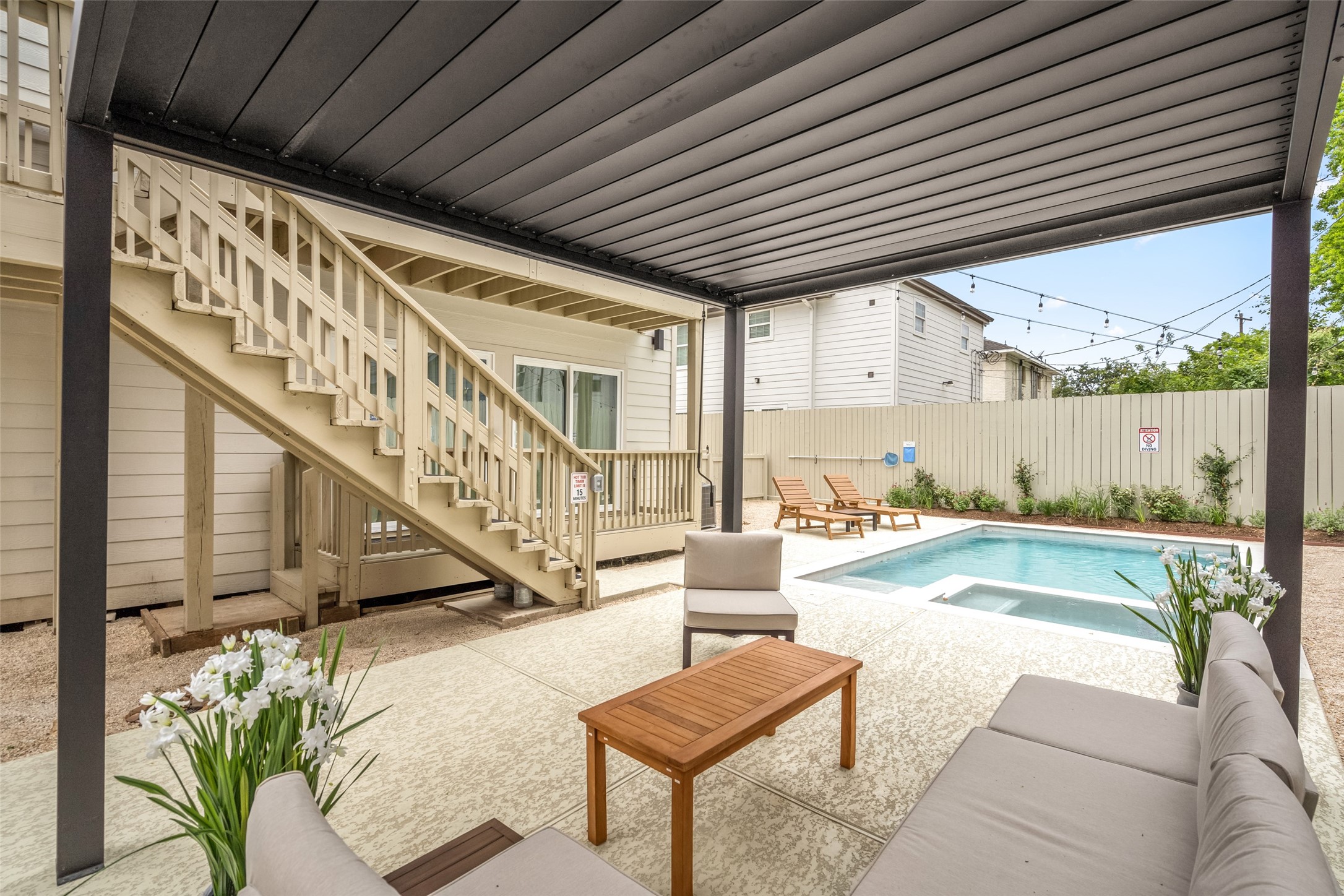 2413 Isabella Street Houston, TX 77004 - Photo 43 of 50 a swimming pool with outdoor seating and stairs