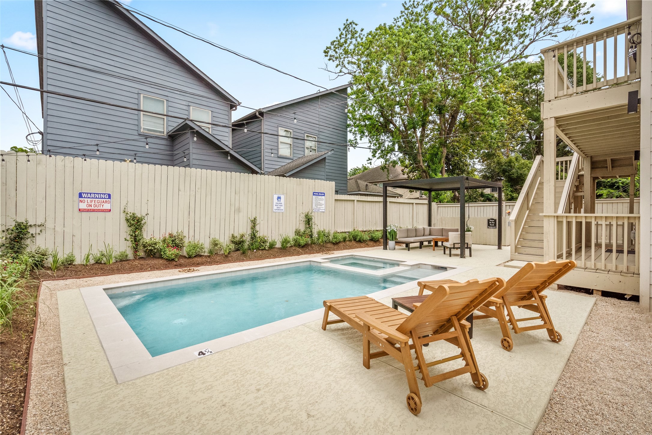 2413 Isabella Street Houston, TX 77004 - Photo 44 of 50 a view of a house with swimming pool and sitting area