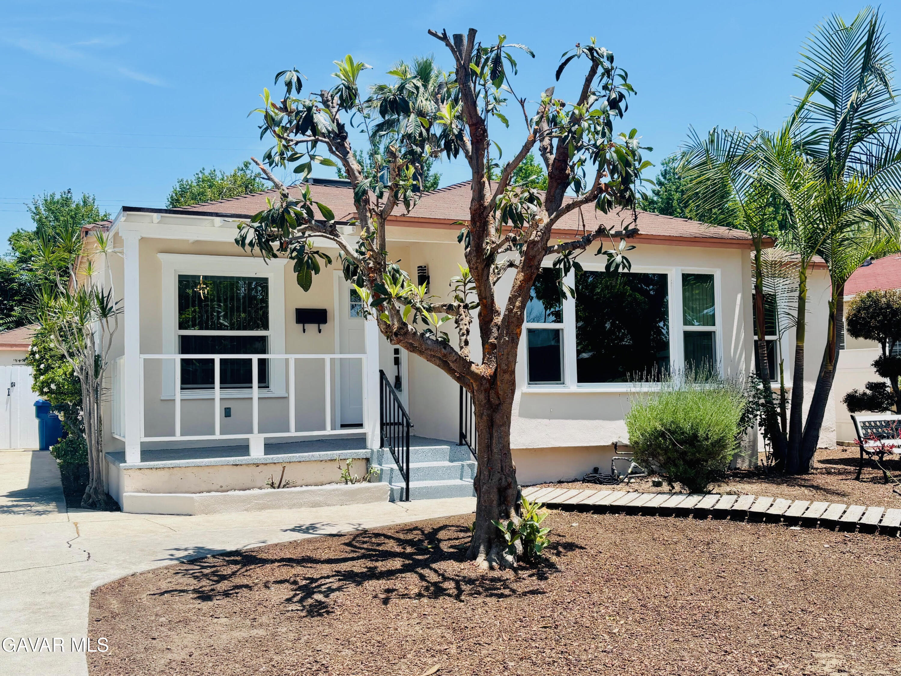 6534 Balcom Avenue Reseda, CA 91335 - Photo 2 of 25 a front view of a house with garden