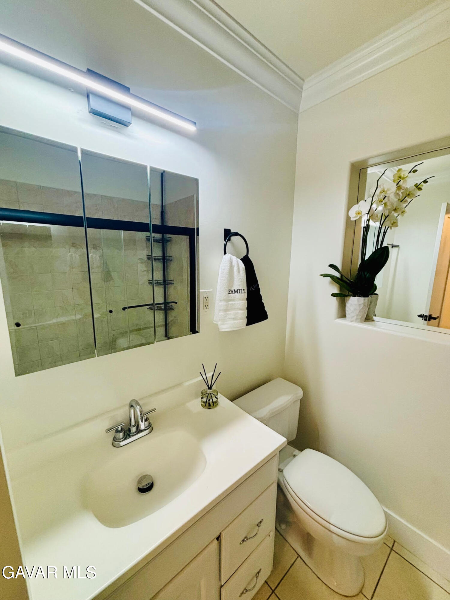 6534 Balcom Avenue Reseda, CA 91335 - Photo 21 of 25 a bathroom with a sink mirror vanity and toilet