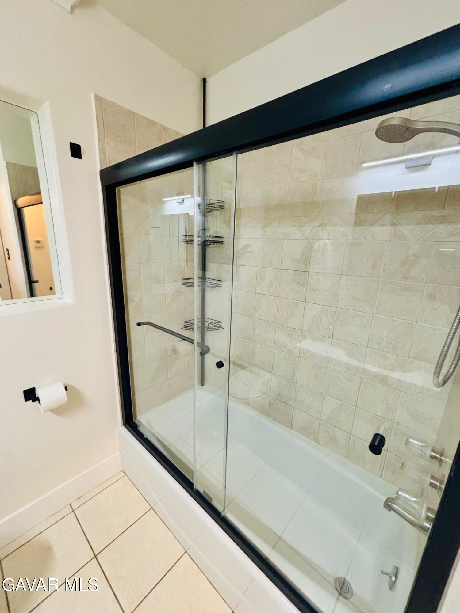 6534 Balcom Avenue Reseda, CA 91335 - Photo 22 of 25 a bathroom with a glass shower door