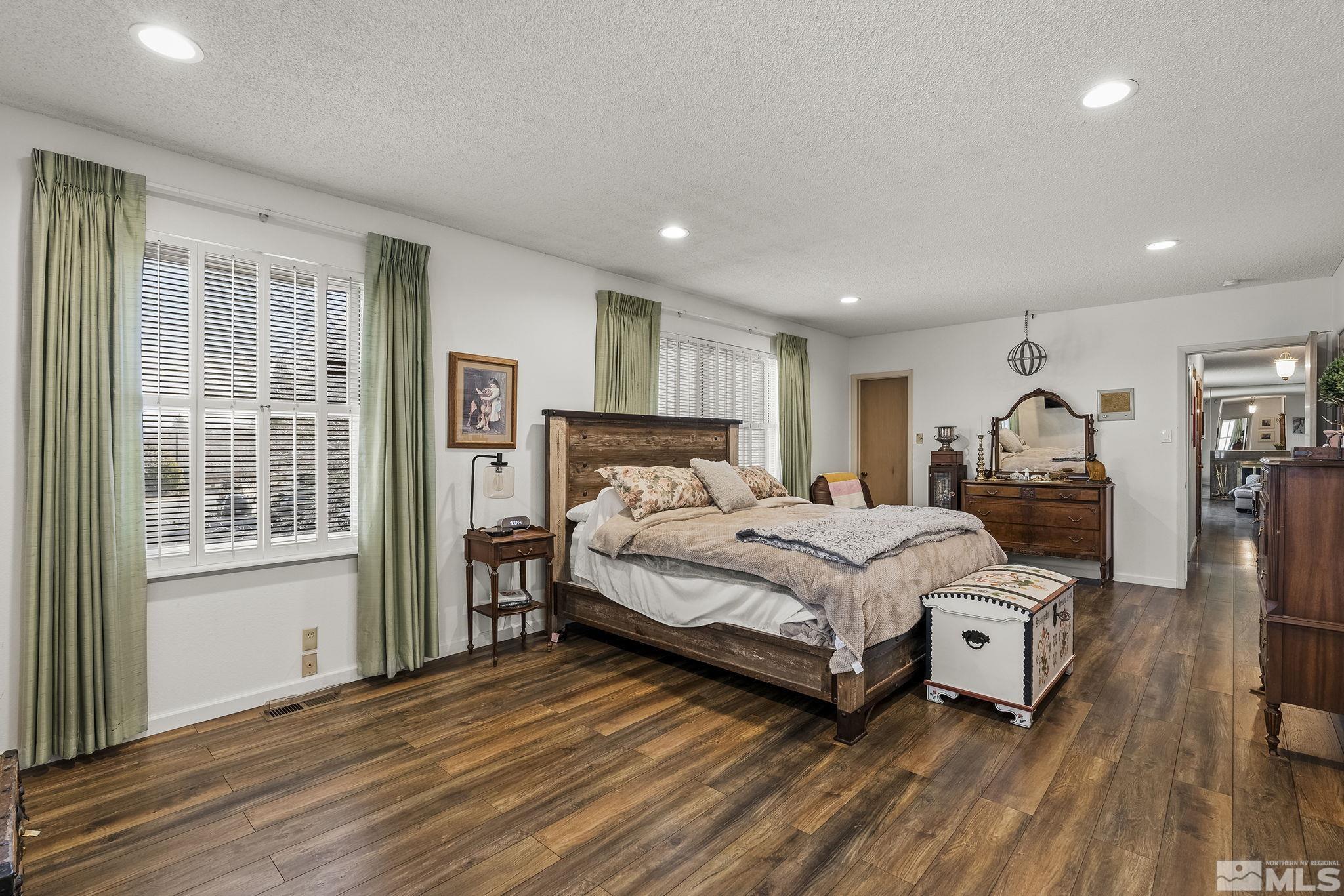 2690 Fair Circle Reno, NV 89503 - Photo 11 of 40 a bedroom with a bed wooden floor and a window