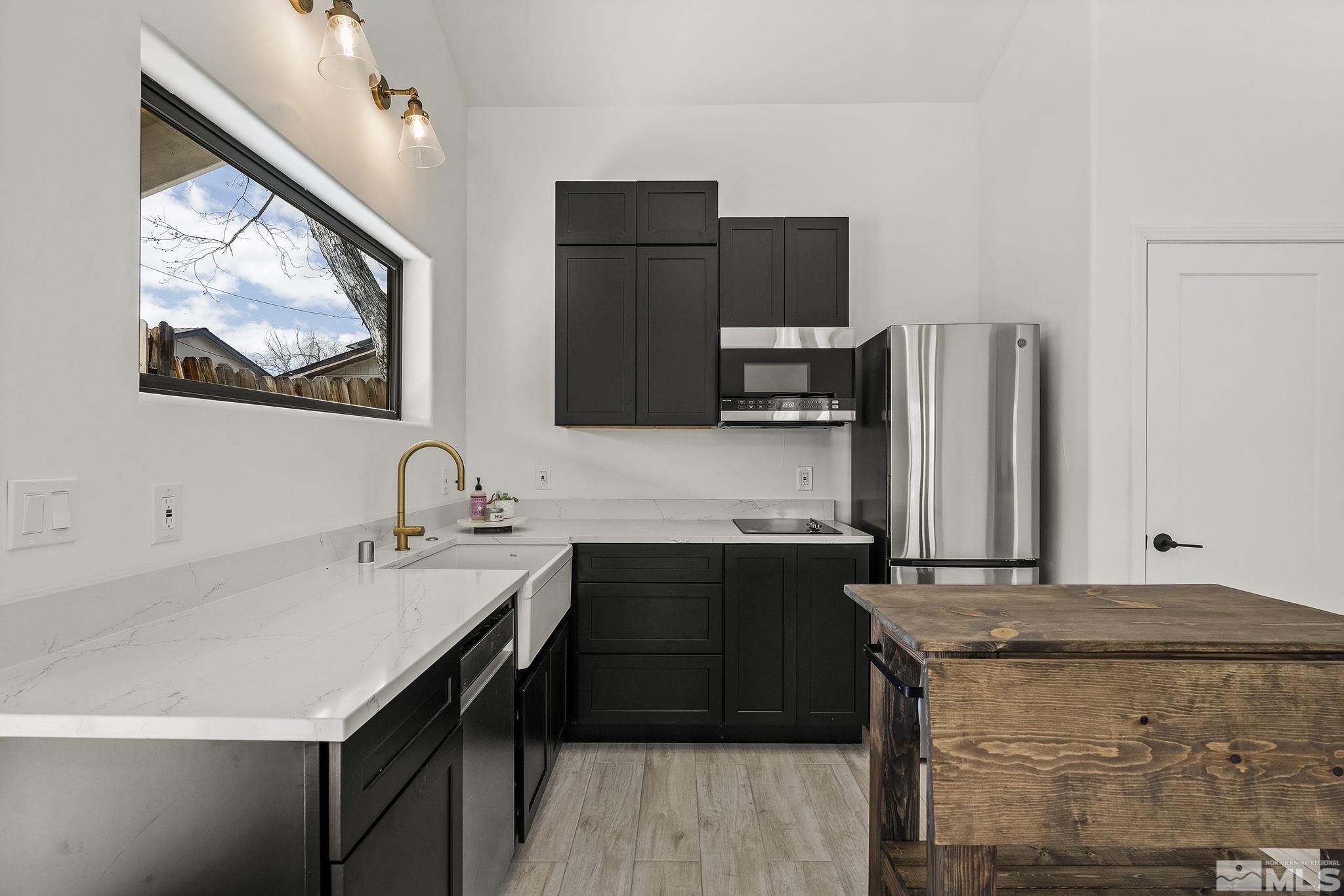 2690 Fair Circle Reno, NV 89503 - Photo 20 of 40 a kitchen with a sink and a refrigerator