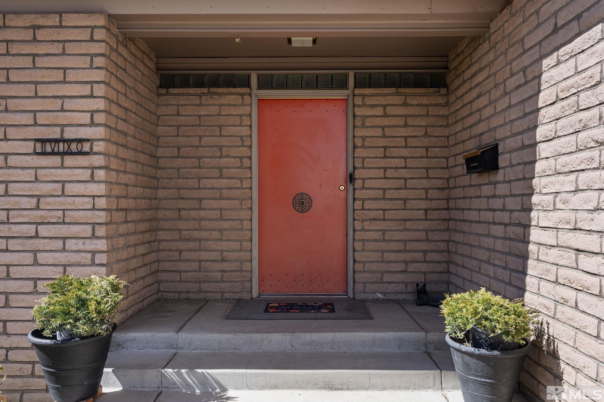 2690 Fair Circle Reno, NV 89503 - Photo 2 of 40 a front view of a house with flowers