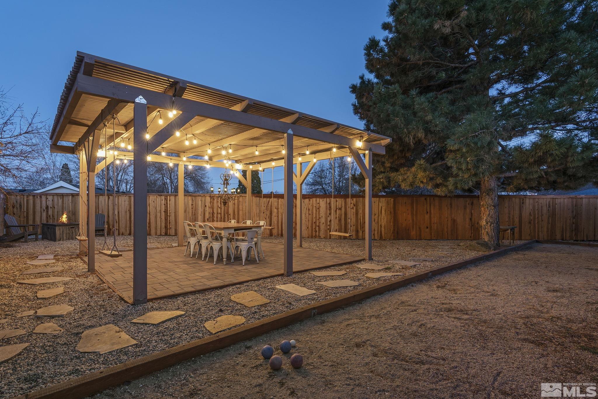 2690 Fair Circle Reno, NV 89503 - Photo 35 of 40 a backyard of a house with barbeque oven table and chairs