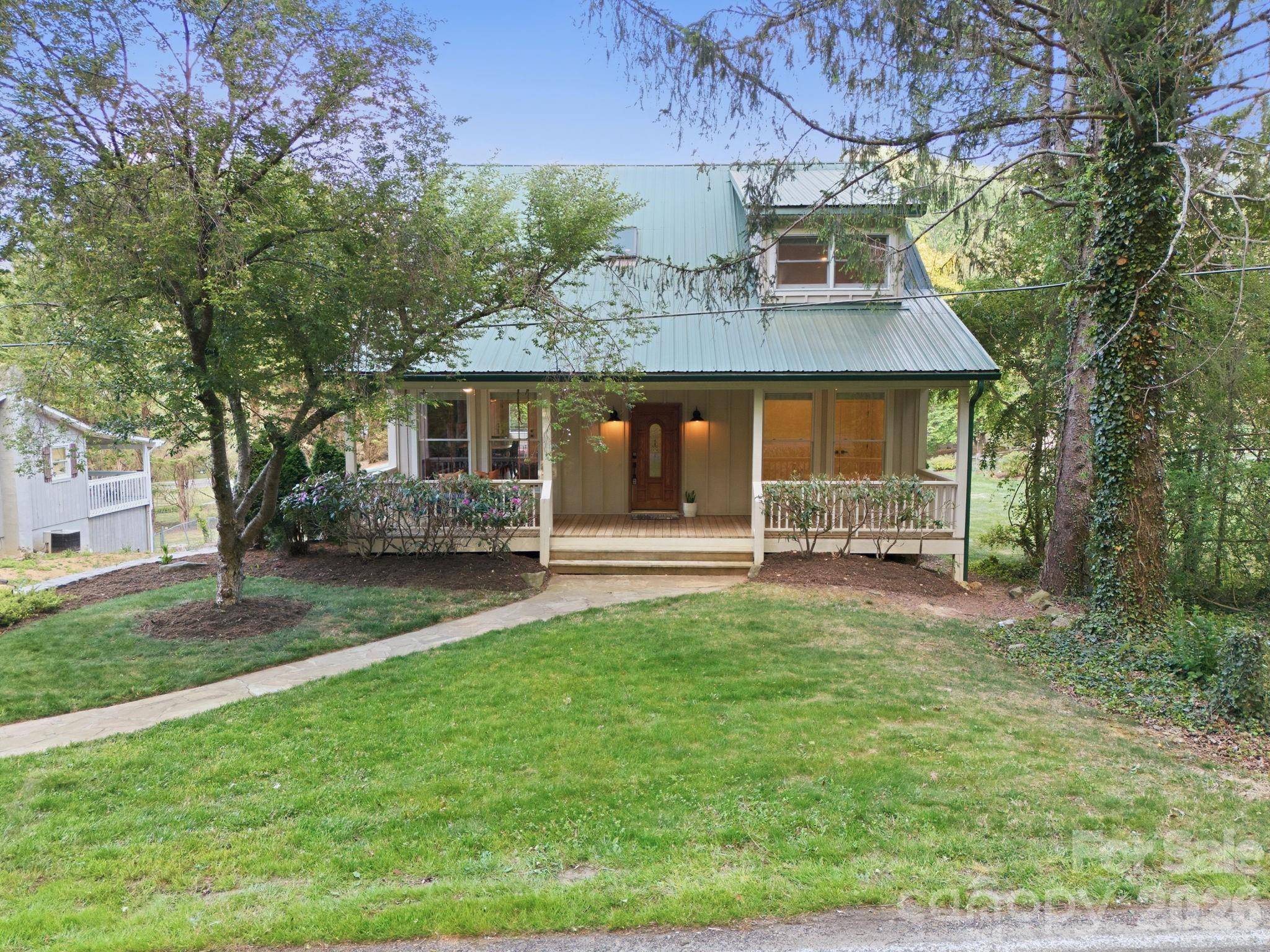 612 Christian Creek Road Swannanoa, NC 28778 - Photo 1 of 37 a front view of a house with a yard
