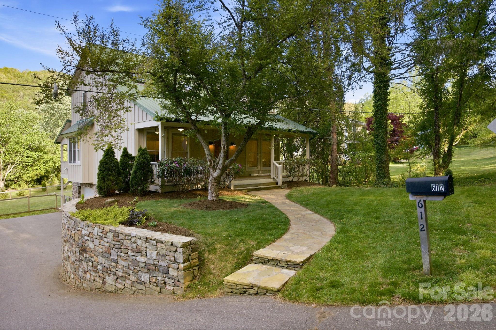 612 Christian Creek Road Swannanoa, NC 28778 - Photo 31 of 37 front view of a house with a yard