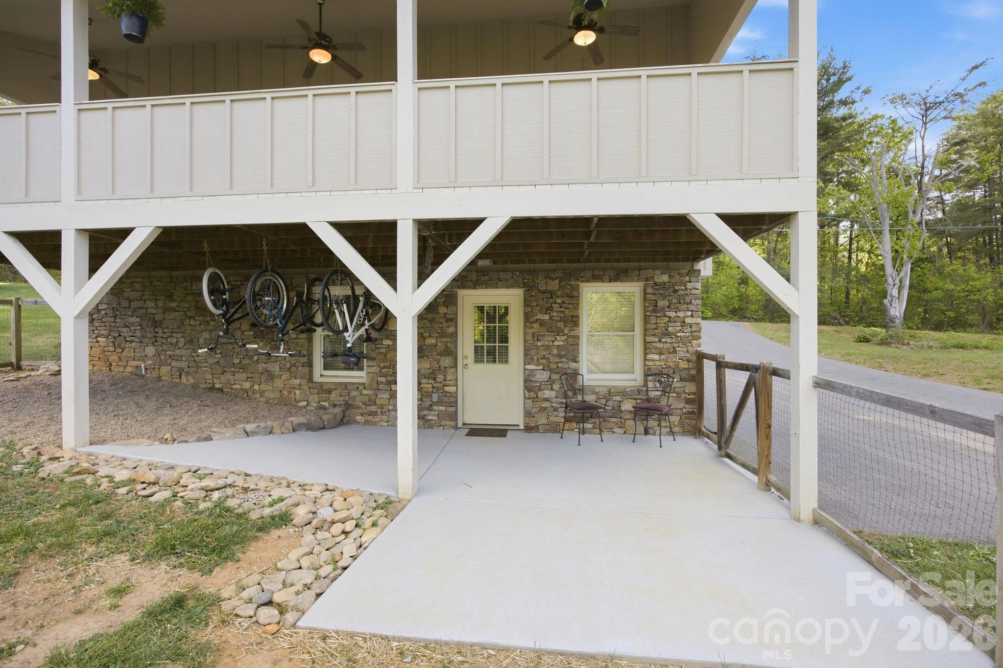 612 Christian Creek Road Swannanoa, NC 28778 - Photo 33 of 37 a view of a house with backyard and sitting area