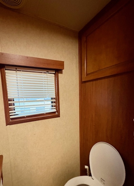 20-57 Woodhaven Sublette, IL 61367 - Photo 16 of 16 a bathroom with a toilet a sink and mirror