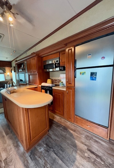 20-57 Woodhaven Sublette, IL 61367 - Photo 5 of 16 a living room with stainless steel appliances granite countertop a sink a stove and a refrigerator