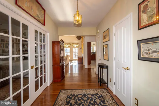 a kitchen with stainless steel appliances granite countertop a sink a stove counter space and cabinets