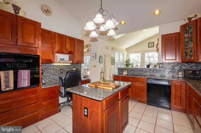 a view of a livingroom with furniture wooden floor and a window