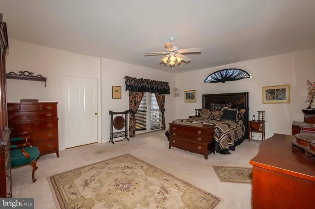 an aerial view of a residential houses with outdoor space and lake view