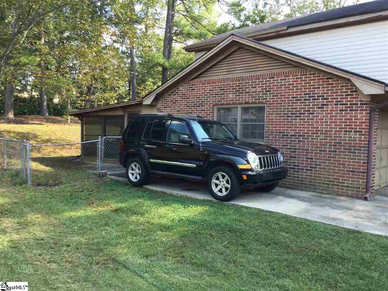 609 Neely Ferry Road Simpsonville, SC 29680 - Photo 22 of 27 There is extra pad to extend garage, or add carport, lots of room for vehicles.