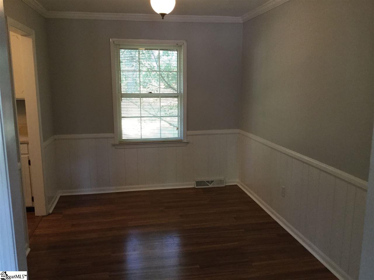 609 Neely Ferry Road Simpsonville, SC 29680 - Photo 10 of 27 Formal Dining room adjacent to Kitchen and Family Room, great detail in wainscoting and chair rail