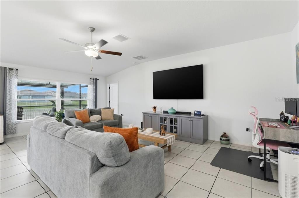1923 Red Loop Lakeland, FL 33801 - Photo 12 of 51 a living room with furniture and a flat screen tv