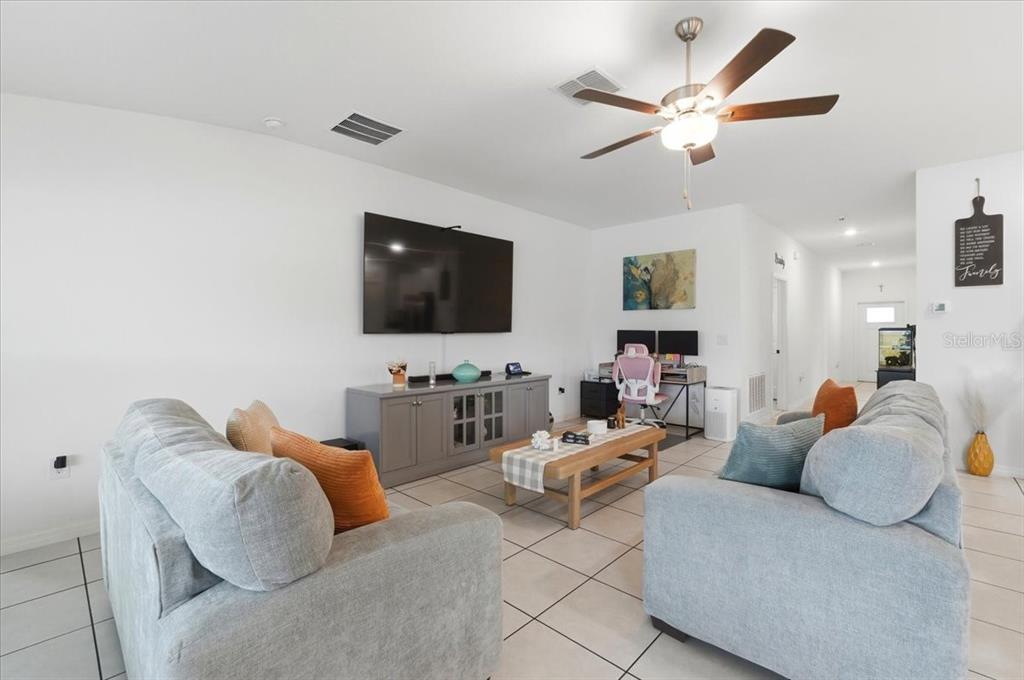 1923 Red Loop Lakeland, FL 33801 - Photo 15 of 51 a living room with furniture and a flat screen tv