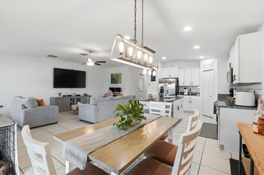 1923 Red Loop Lakeland, FL 33801 - Photo 16 of 51 a living room with furniture kitchen view and a flat screen tv