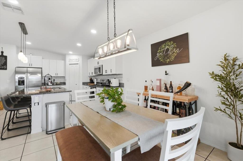 1923 Red Loop Lakeland, FL 33801 - Photo 17 of 51 a kitchen with kitchen island granite countertop lots of counter top space and stainless steel appliances