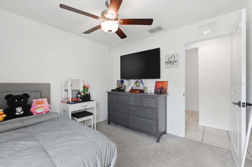 1923 Red Loop Lakeland, FL 33801 - Photo 33 of 51 a bedroom with a bed and a flat screen tv