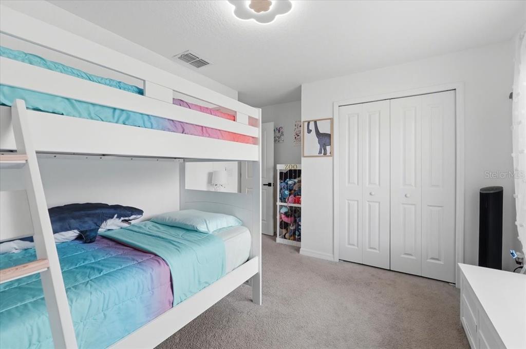 1923 Red Loop Lakeland, FL 33801 - Photo 36 of 51 a bedroom with a bed and a closet